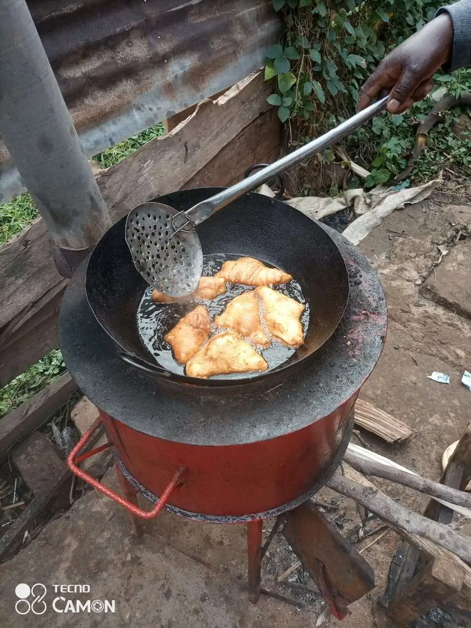 Jaffan's wife making bans (mandazi)